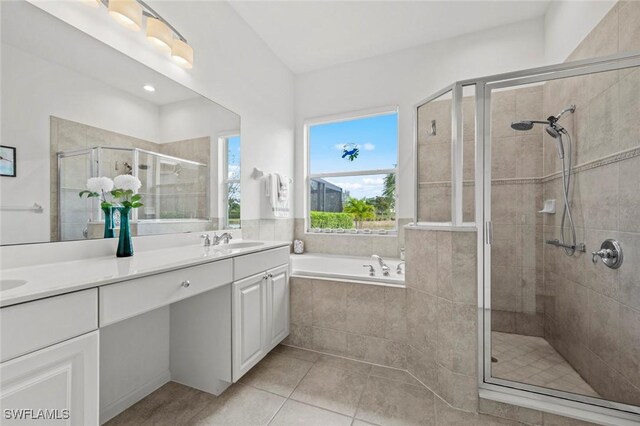 bathroom featuring independent shower and bath, tile patterned flooring, and vanity