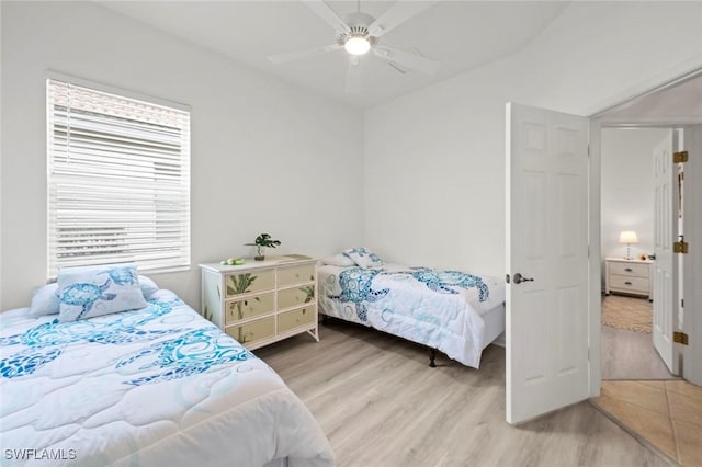 bedroom with ceiling fan and wood-type flooring