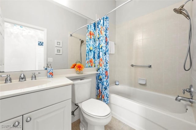 full bathroom featuring shower / bath combo with shower curtain, tile patterned floors, toilet, and vanity