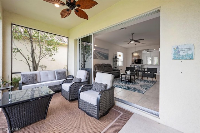 view of patio with ceiling fan and an outdoor hangout area