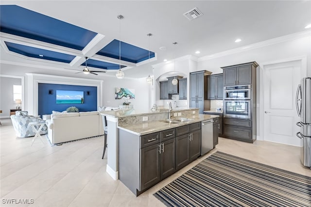 kitchen with coffered ceiling, pendant lighting, a breakfast bar, beam ceiling, and sink