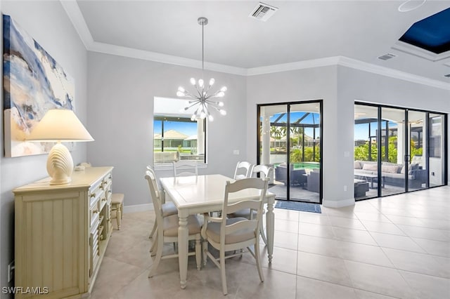 dining room featuring an inviting chandelier, ornamental molding, and light tile patterned floors