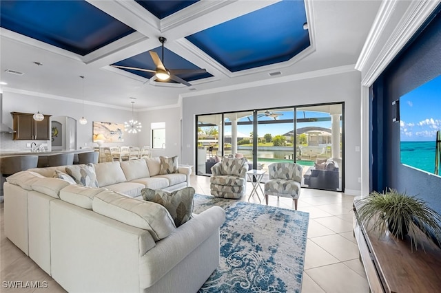 living room with a water view, light tile patterned floors, coffered ceiling, crown molding, and beam ceiling