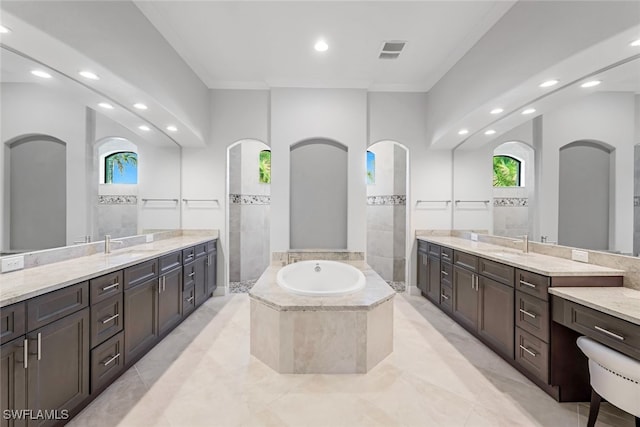 bathroom featuring ornamental molding, separate shower and tub, and vanity