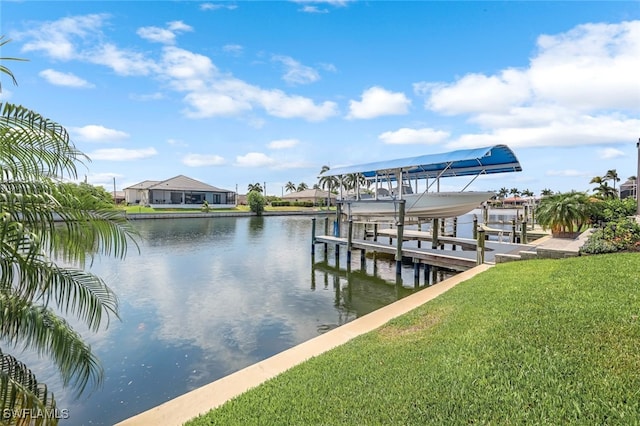 view of dock featuring a yard and a water view