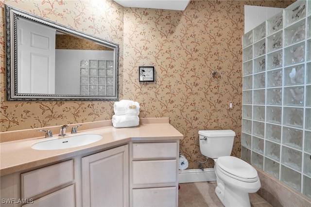 bathroom with toilet and vanity