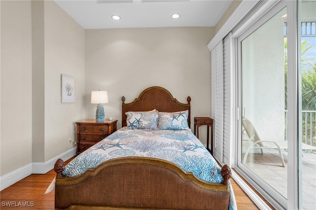 bedroom featuring light hardwood / wood-style floors and access to outside