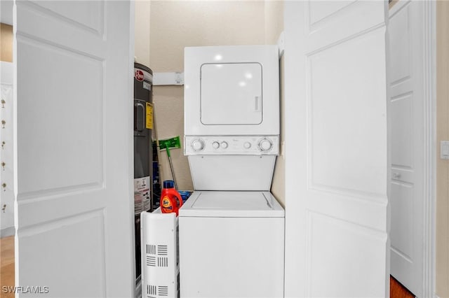 clothes washing area with stacked washer / drying machine