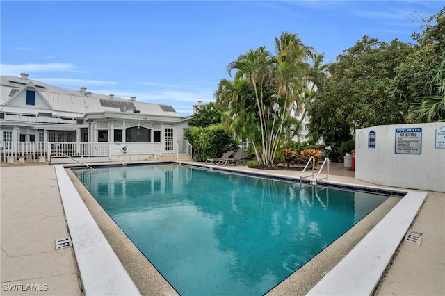 view of swimming pool featuring a patio