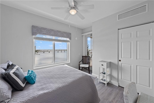 bedroom featuring ceiling fan and wood-type flooring