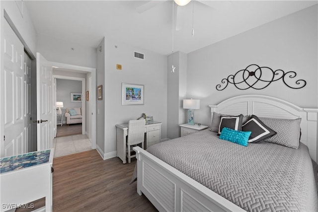 bedroom featuring wood-type flooring, a closet, and ceiling fan