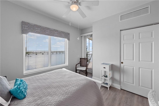 bedroom featuring ceiling fan and light hardwood / wood-style floors