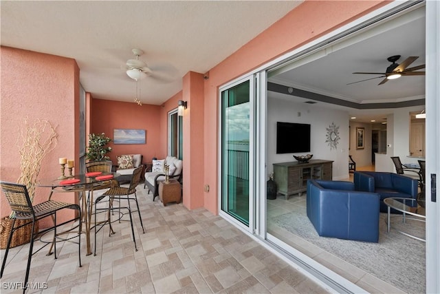 interior space with ceiling fan and an outdoor living space