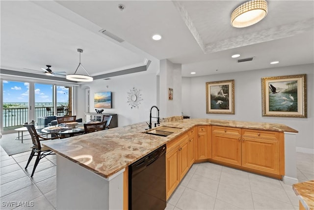 kitchen with sink, decorative light fixtures, black dishwasher, ceiling fan, and a tray ceiling