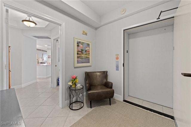 sitting room featuring light tile patterned flooring