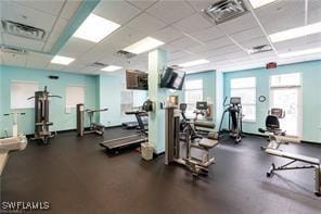 gym featuring a drop ceiling