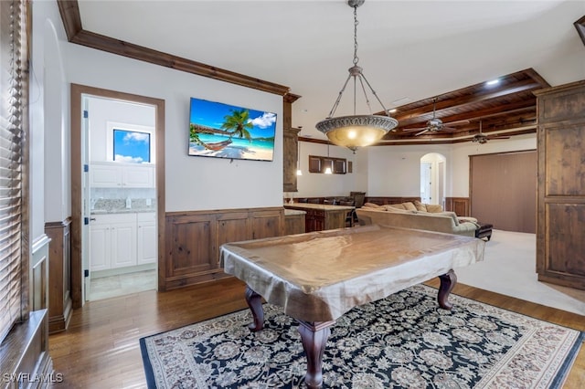 game room with ornamental molding, light wood-type flooring, ceiling fan, and billiards