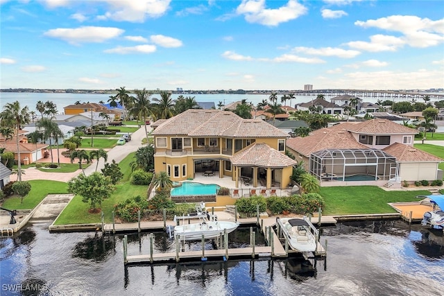 birds eye view of property with a water view