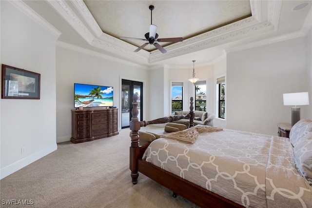 carpeted bedroom featuring a tray ceiling, ornamental molding, ceiling fan, french doors, and access to exterior