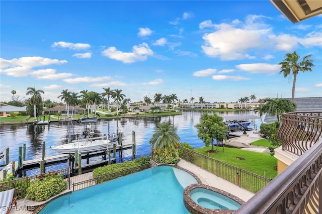 view of pool featuring a boat dock, a water view, and an in ground hot tub