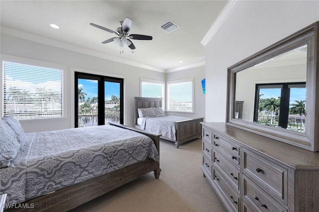 carpeted bedroom featuring access to exterior, ceiling fan, and ornamental molding