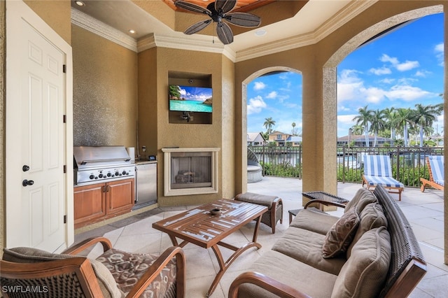 view of patio / terrace with an outdoor fireplace, grilling area, and ceiling fan