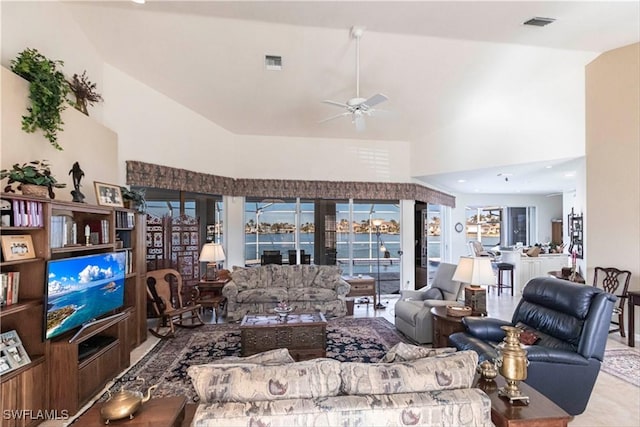 living room featuring high vaulted ceiling and ceiling fan