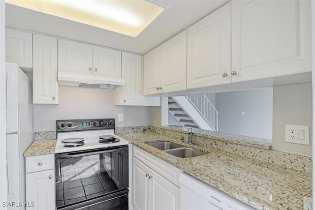 kitchen with white cabinetry, sink, white appliances, and light stone counters