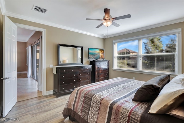 bedroom featuring ceiling fan and ornamental molding