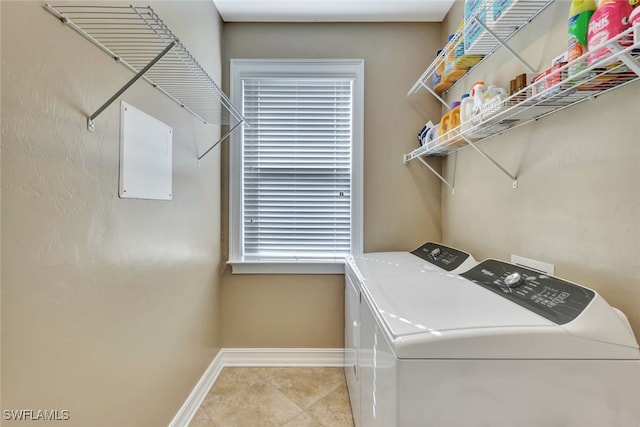 clothes washing area with independent washer and dryer