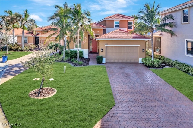 mediterranean / spanish-style house with a garage and a front yard