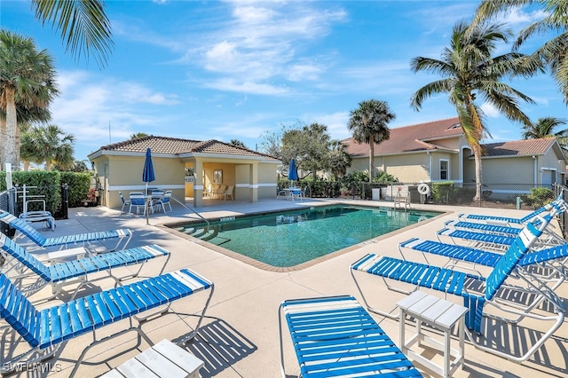 view of swimming pool featuring a patio area