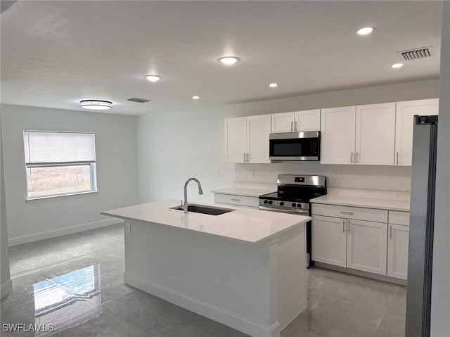 3708 15th St SW, Lehigh Acres, FL 33976 - kitchen with appliances with stainless steel finishes, a sink, white cabinetry, a kitchen island with sink, and recessed lighting
