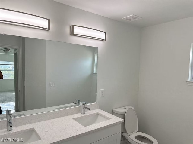3708 15th St SW, Lehigh Acres, FL 33976 - bathroom featuring toilet and double vanity