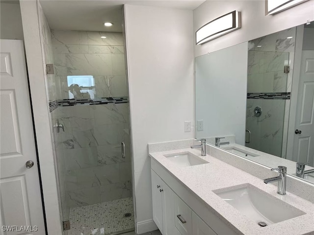 bathroom with walk in shower and vanity