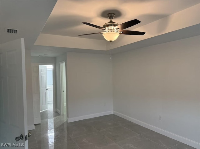 unfurnished room with ceiling fan