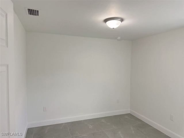 empty room featuring tile patterned floors