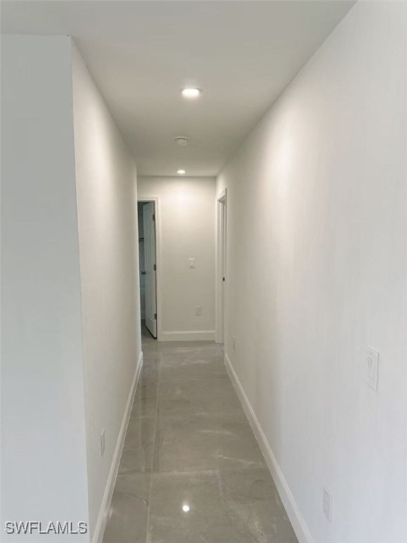 3708 15th St SW, Lehigh Acres, FL 33976 - corridor with baseboards, recessed lighting, and concrete flooring