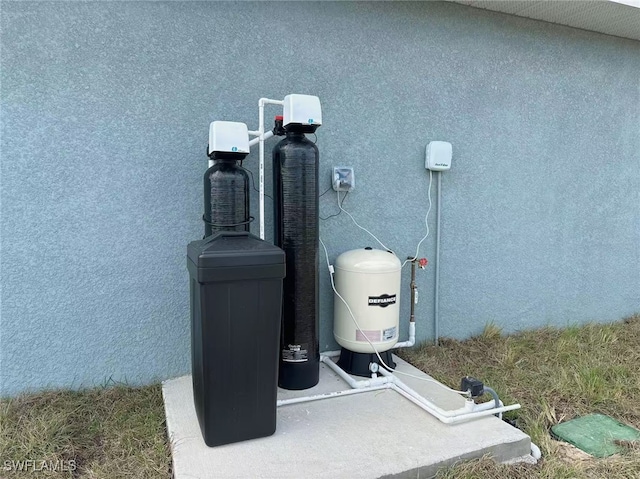 3708 15th St SW, Lehigh Acres, FL 33976 - exterior view of stucco siding and a water softener