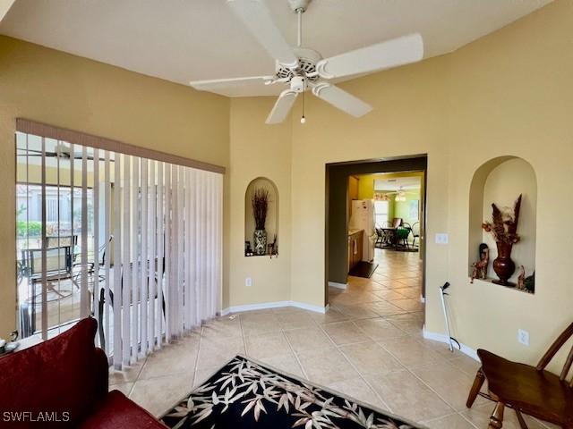 hall featuring light tile patterned floors