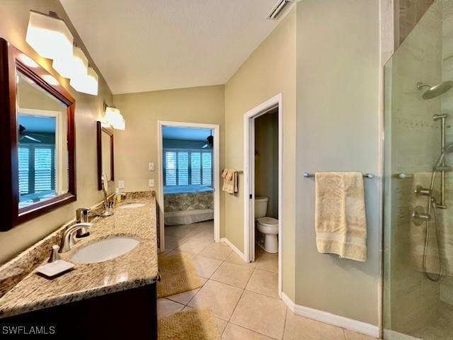 bathroom featuring lofted ceiling, tile patterned flooring, toilet, an enclosed shower, and vanity