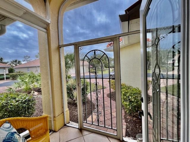 doorway to outside featuring light tile patterned floors