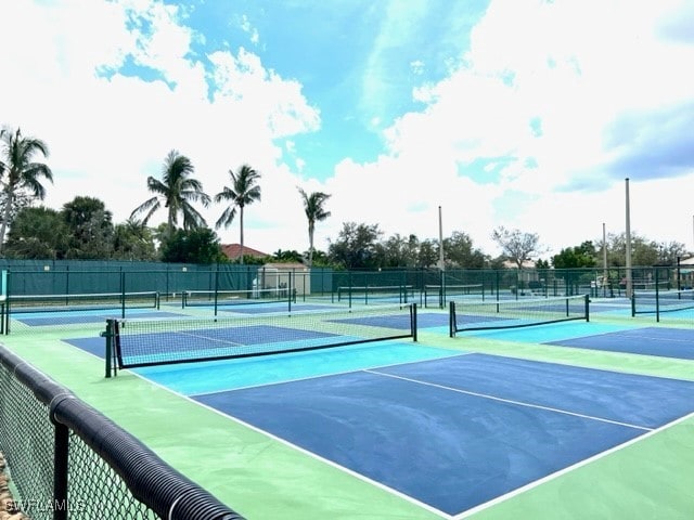 view of tennis court featuring basketball court