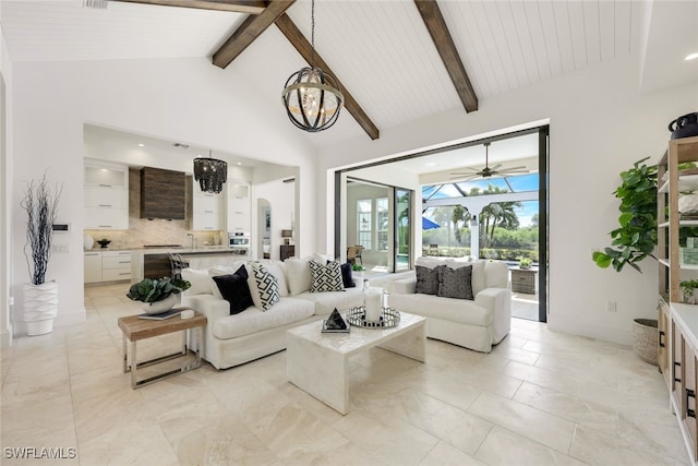 living room featuring a notable chandelier, beamed ceiling, wood ceiling, and high vaulted ceiling