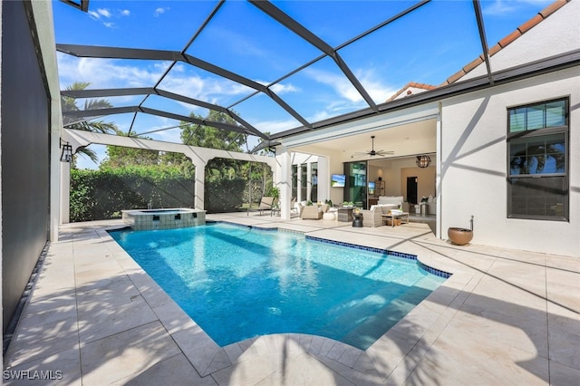 view of pool featuring ceiling fan, an in ground hot tub, a lanai, outdoor lounge area, and a patio area