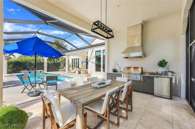 view of patio with glass enclosure, an outdoor kitchen, and grilling area