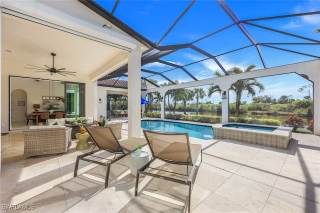 view of pool featuring an outdoor living space, an in ground hot tub, a lanai, and a patio