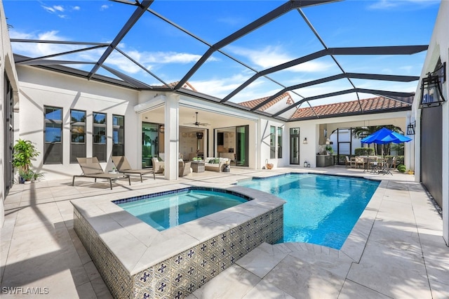 view of pool with an in ground hot tub, a lanai, an outdoor living space, and a patio