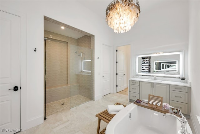 bathroom with vanity, a notable chandelier, and plus walk in shower