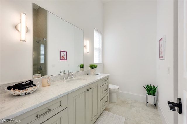 bathroom with tiled shower, vanity, toilet, and tile patterned flooring